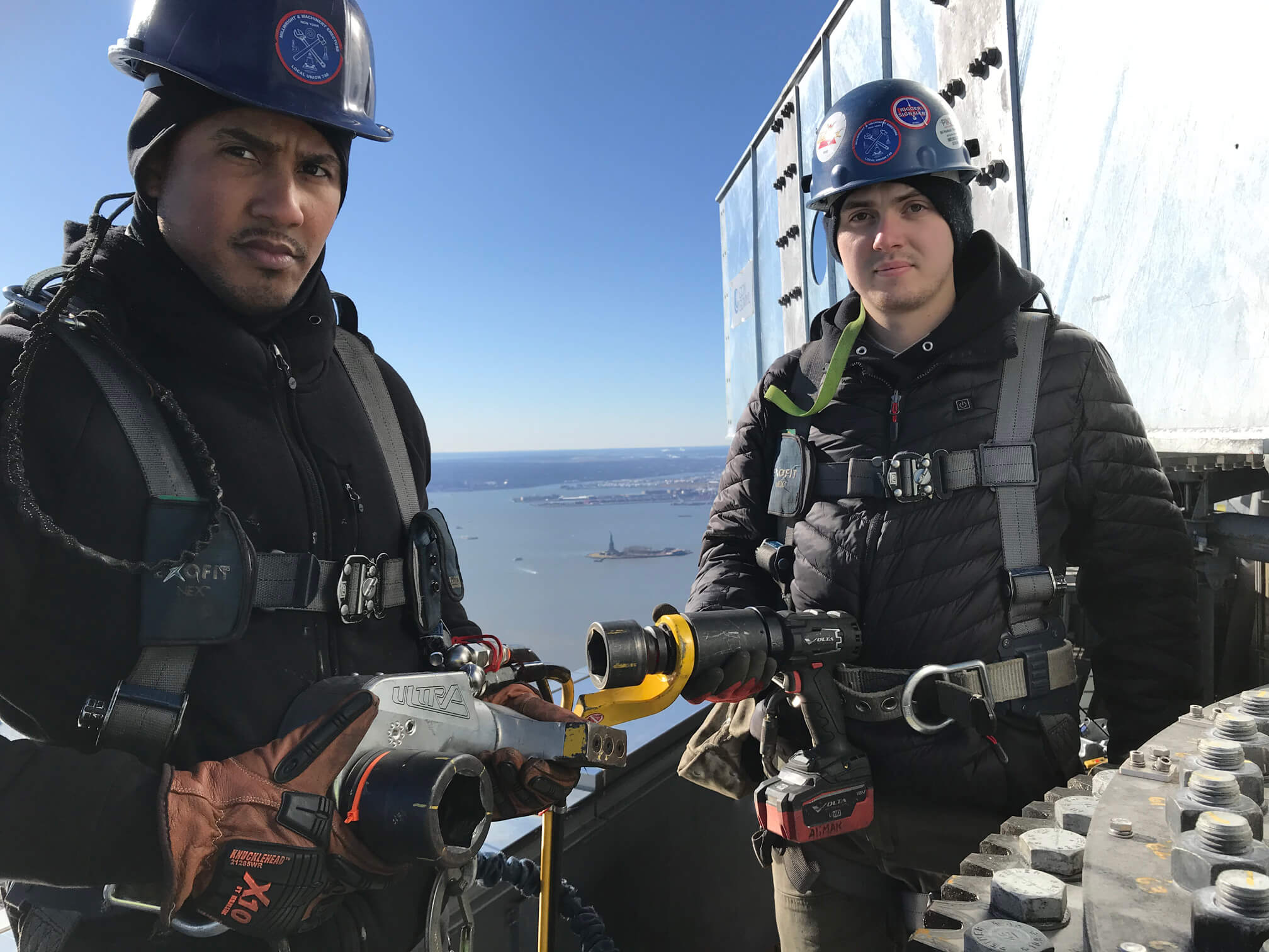 Ironworkers using TorcUP tools atop One World Trade Center